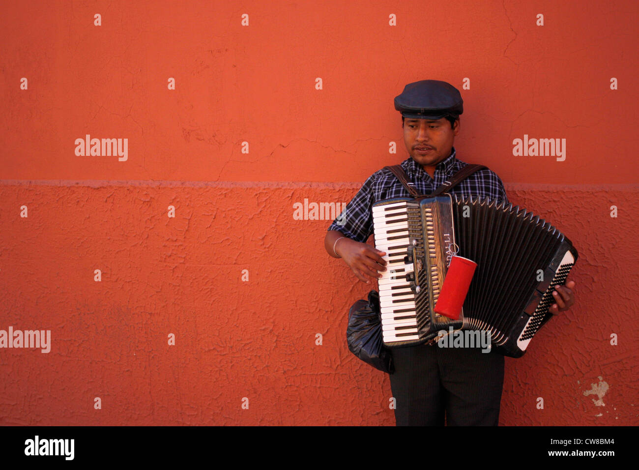 A blind accordionist plays the accordion in a street of Oaxaca, Mexico, July 7, 2012. Stock Photo