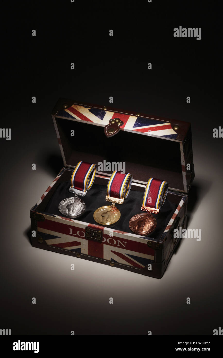 Light Reflection On Medals In Briefcase Stock Photo