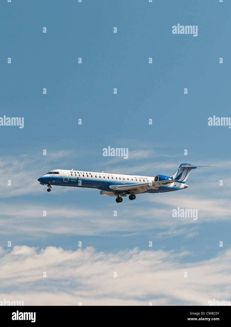 United Express (Skywest Airlines) plane Bombardier CRJ-700 regional jet air liner on final approach for landing. Stock Photo