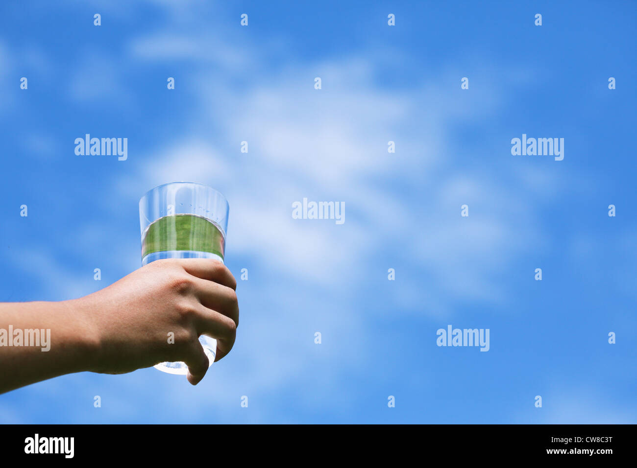Human Hand Holding Drinking Glass Stock Photo