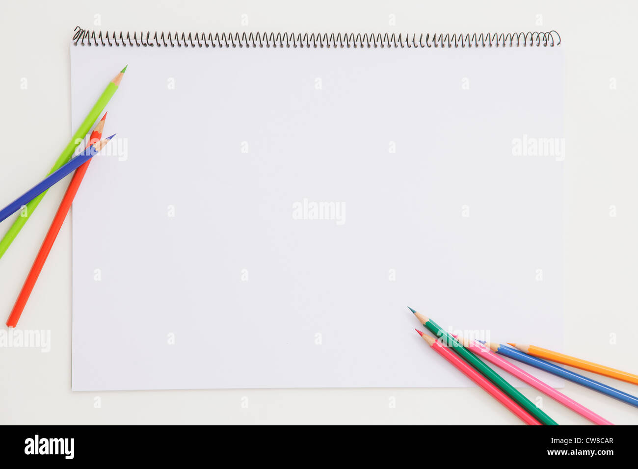 Different Color Pencil On Notepad Stock Photo