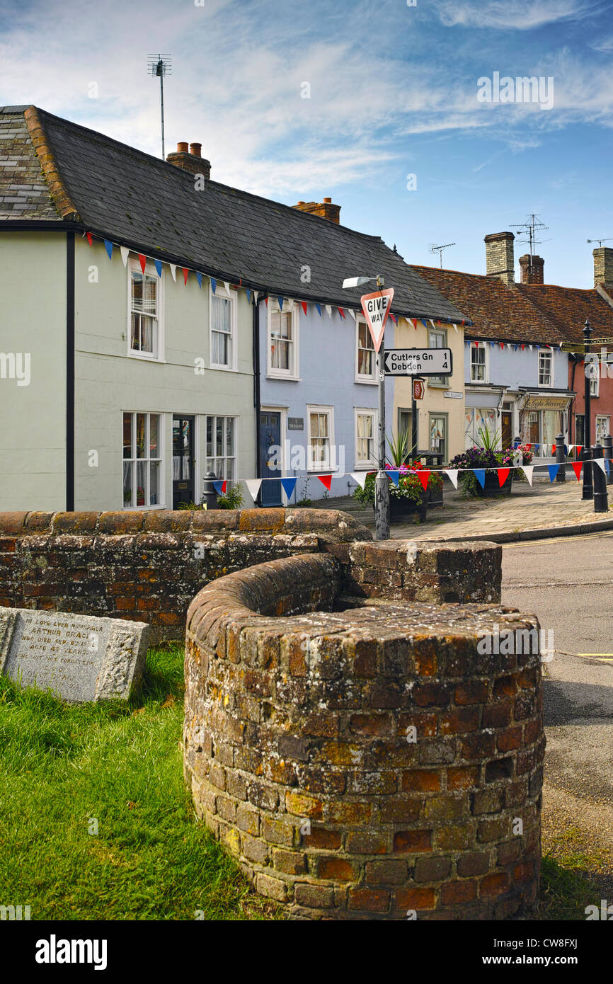 Thaxted 'Bull Ring' with foregound brick wall from the Church. Stock Photo