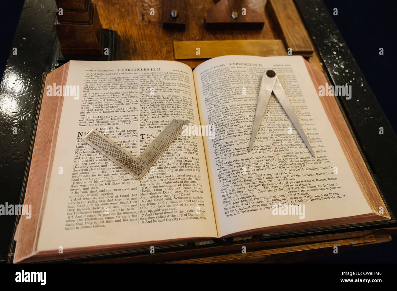 King James Bible on a Masonic altar with a set square and compasses