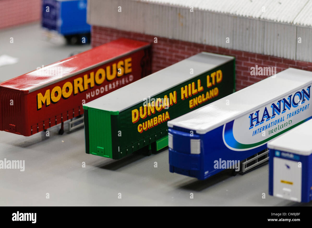 Model lorries/trucks containers at a model warehouse and loading bays Stock Photo