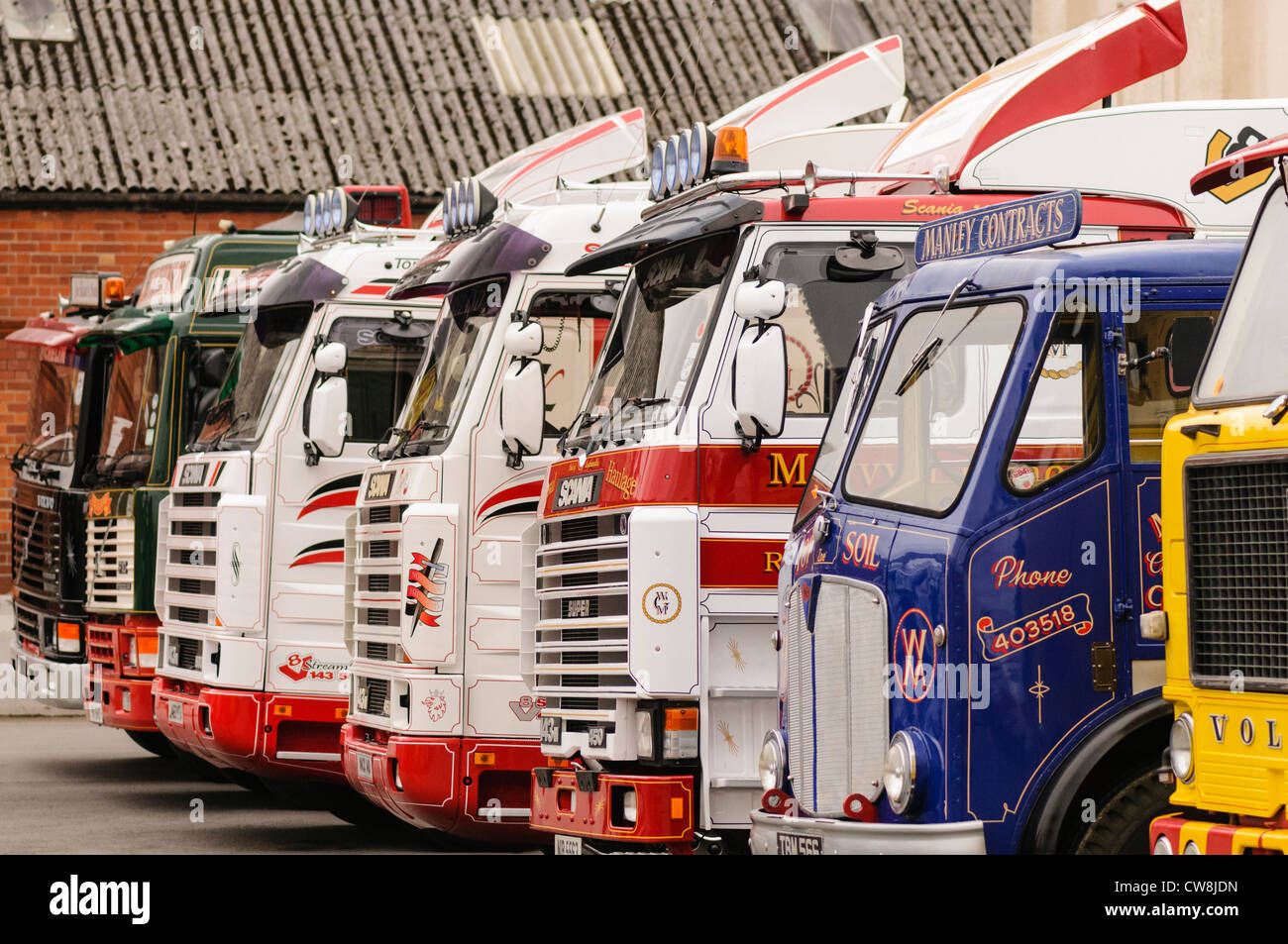 Number of lorries/trucks parked up in a row Stock Photo