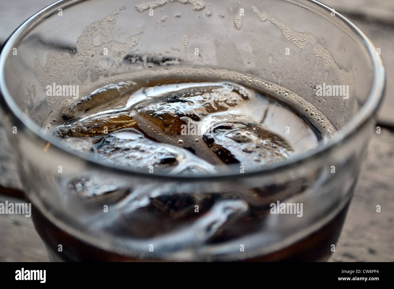 closeup of a glass of rum and coke with icecubes. Stock Photo