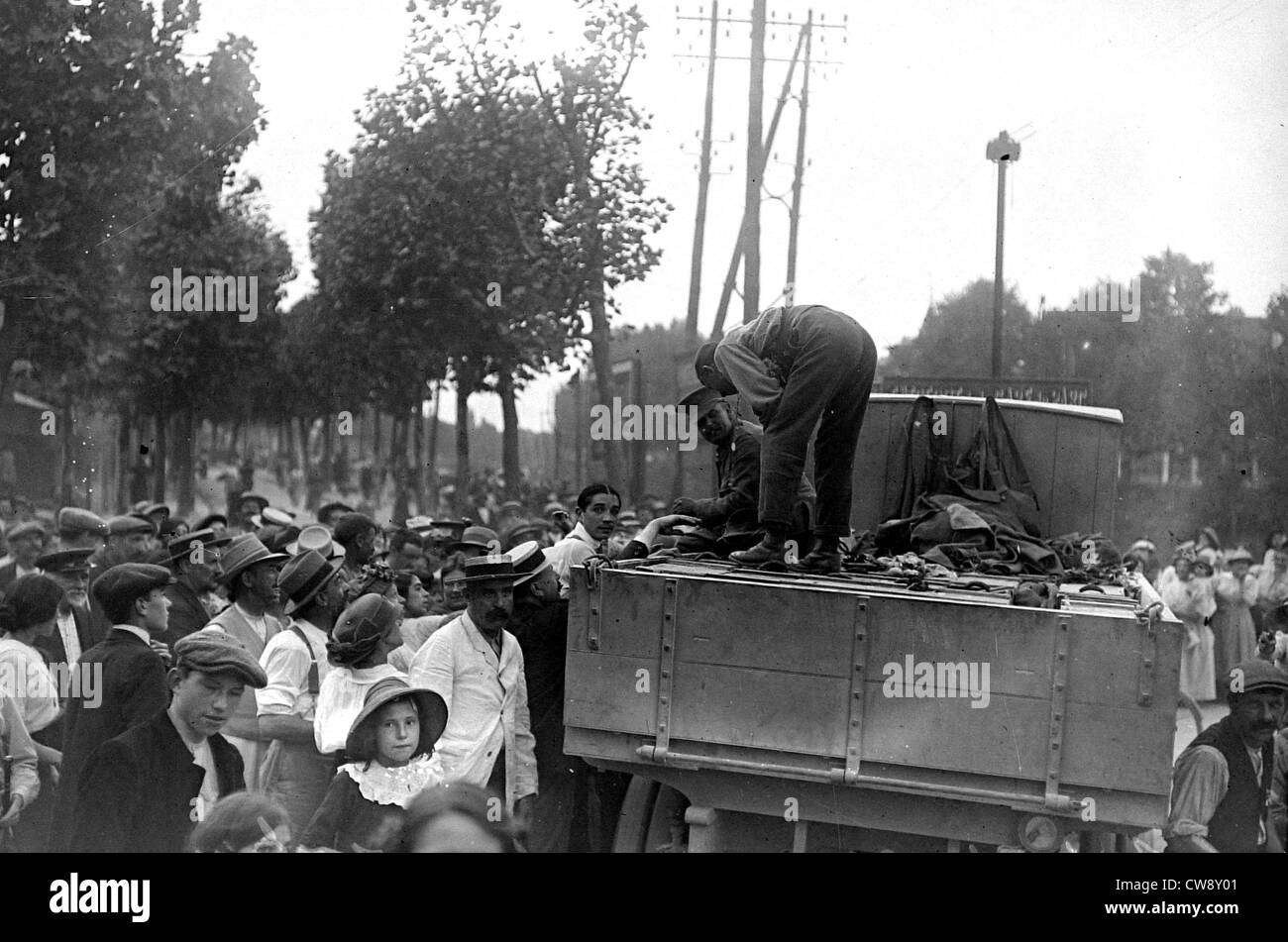 A crowd around an English truck Stock Photo