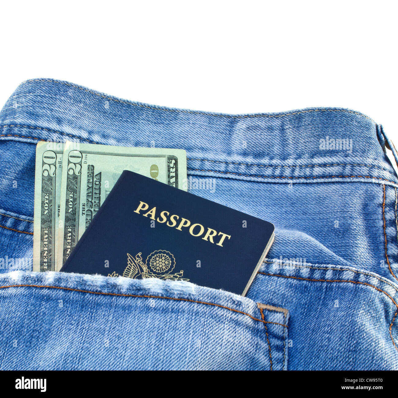 American blue passport and twenty dollar bills in light blue denim jeans pocket isolated on white background. Stock Photo
