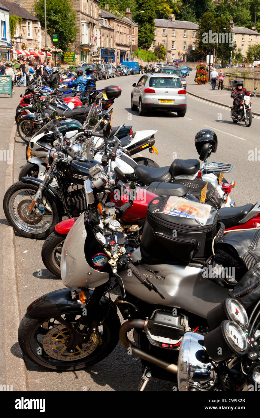 Line of motorcycles parked along the A6 road during Summer, Matlock Bath, Derbyshire, England, UK Stock Photo