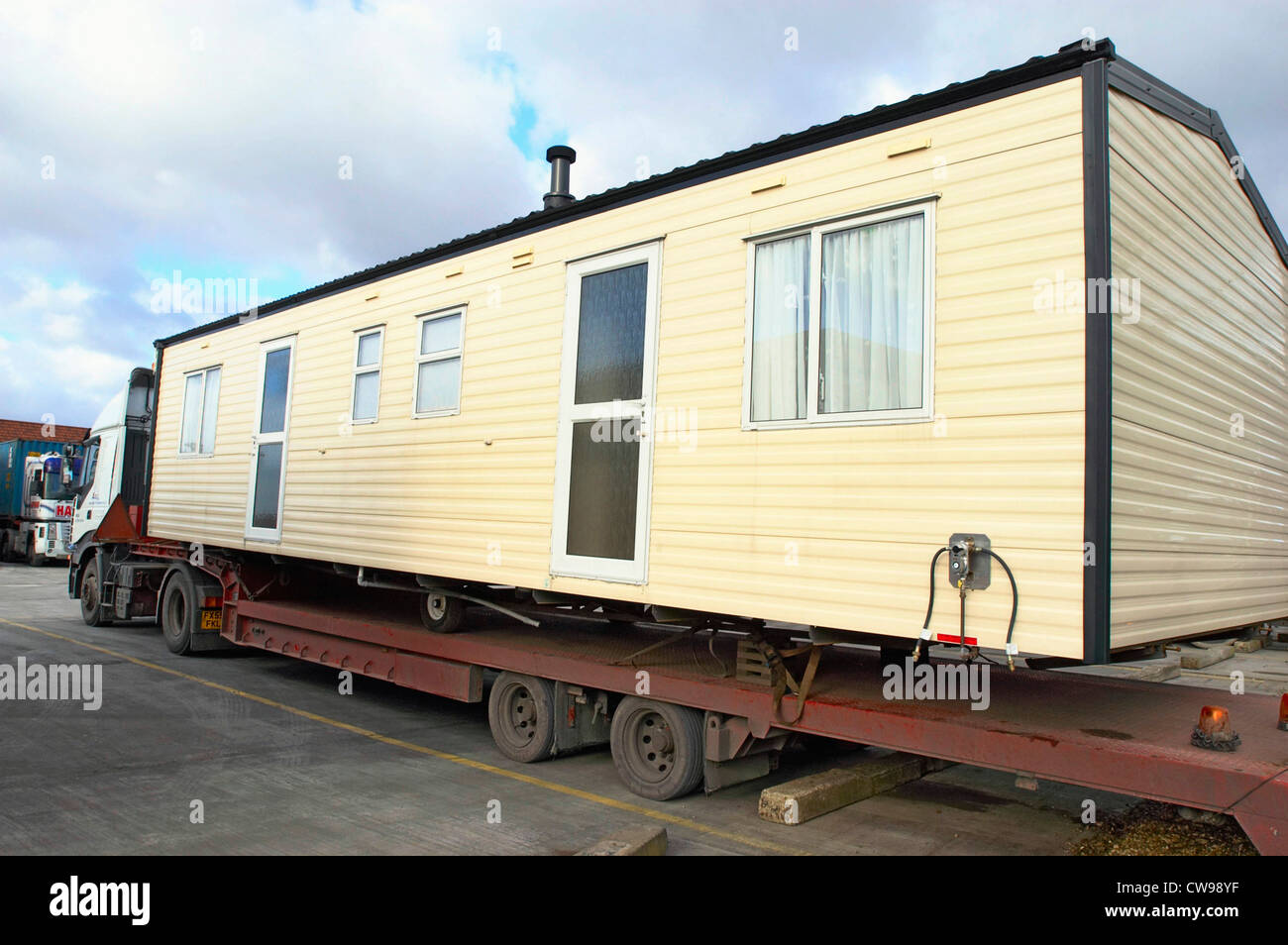 Mobile home displace with lorry. Stock Photo