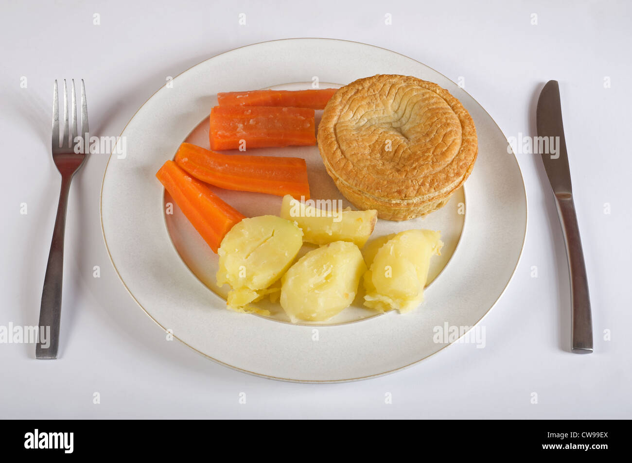Meat pie carrots and boiled potatoes Stock Photo