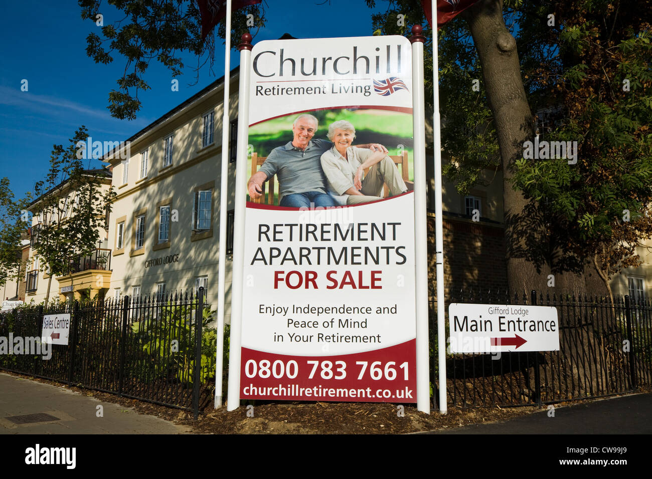 For Sale sign and advertising board & new build / building retirement living apartment block / apartments for sale to retired OAP senior old people UK Stock Photo