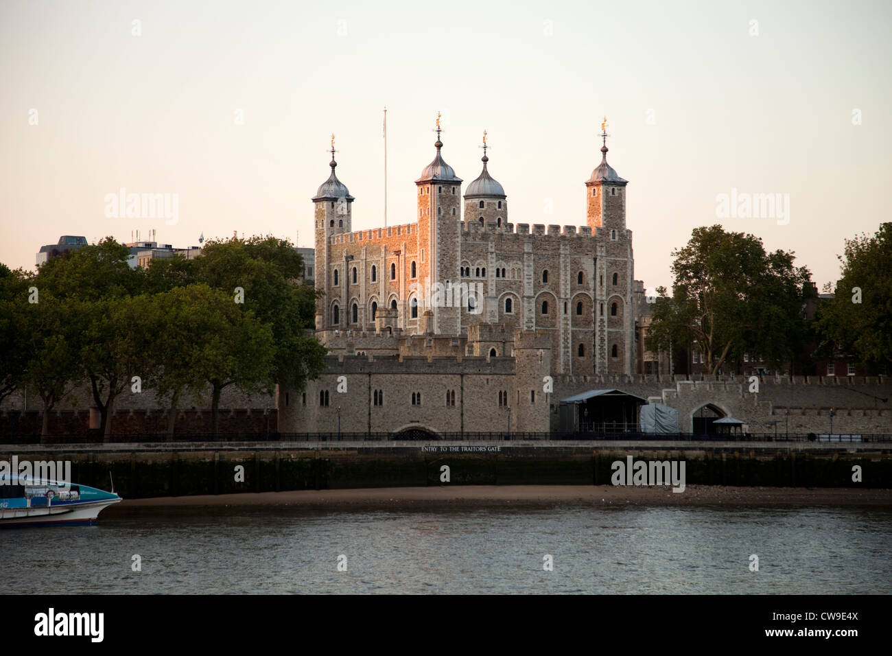 The Tower of London on the north bank of the Thames near Tower Bridge at dusk, London Stock Photo
