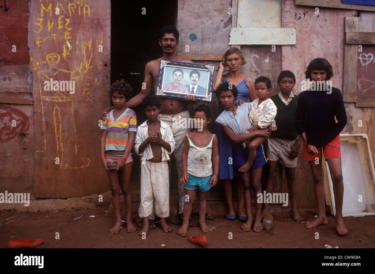 Family Brasilia Brazil South America standing outside their favela