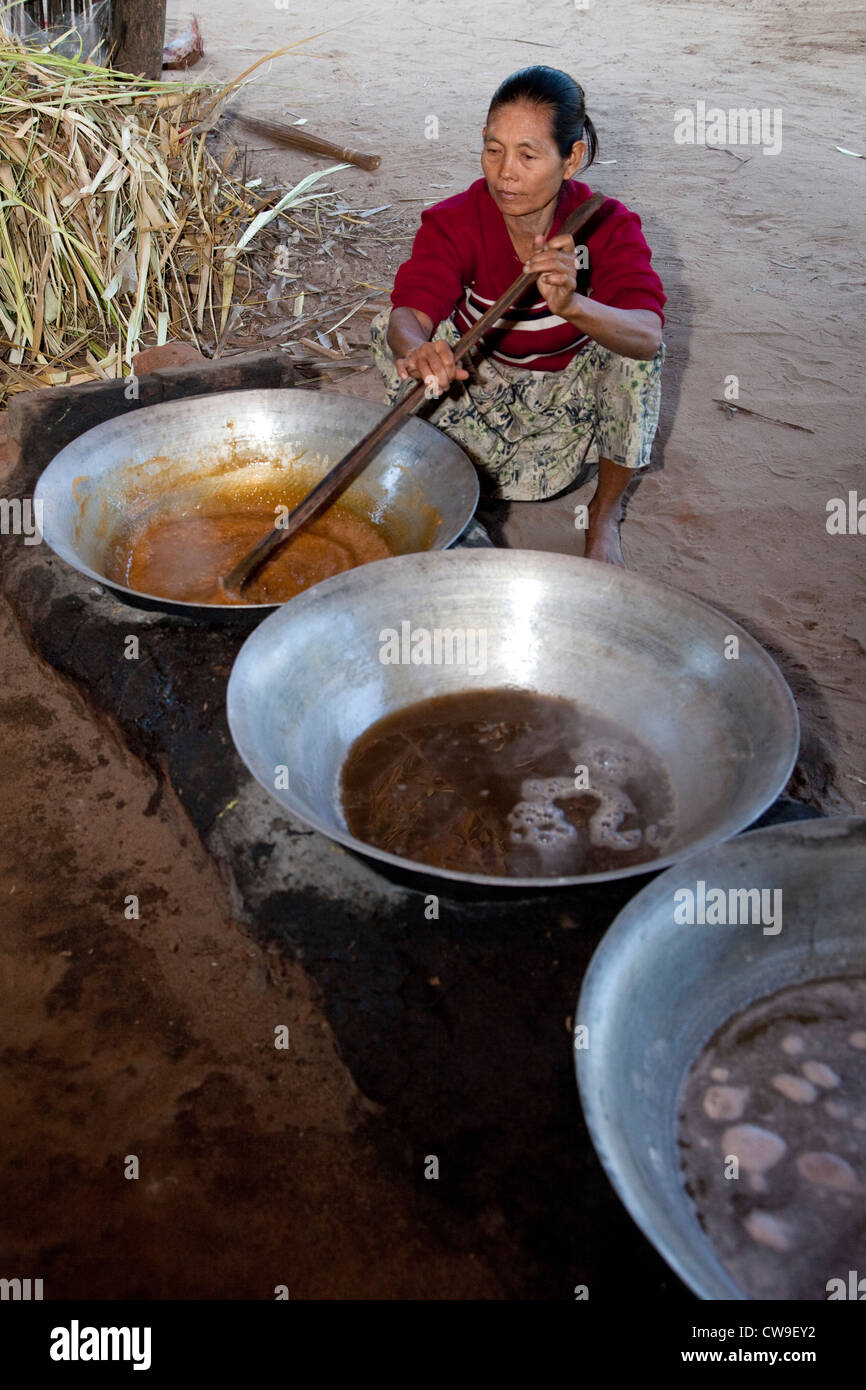 Myanmar, Burma, near Bagan. Heating Toddy Palm Juice to Make Sugar. Stock Photo