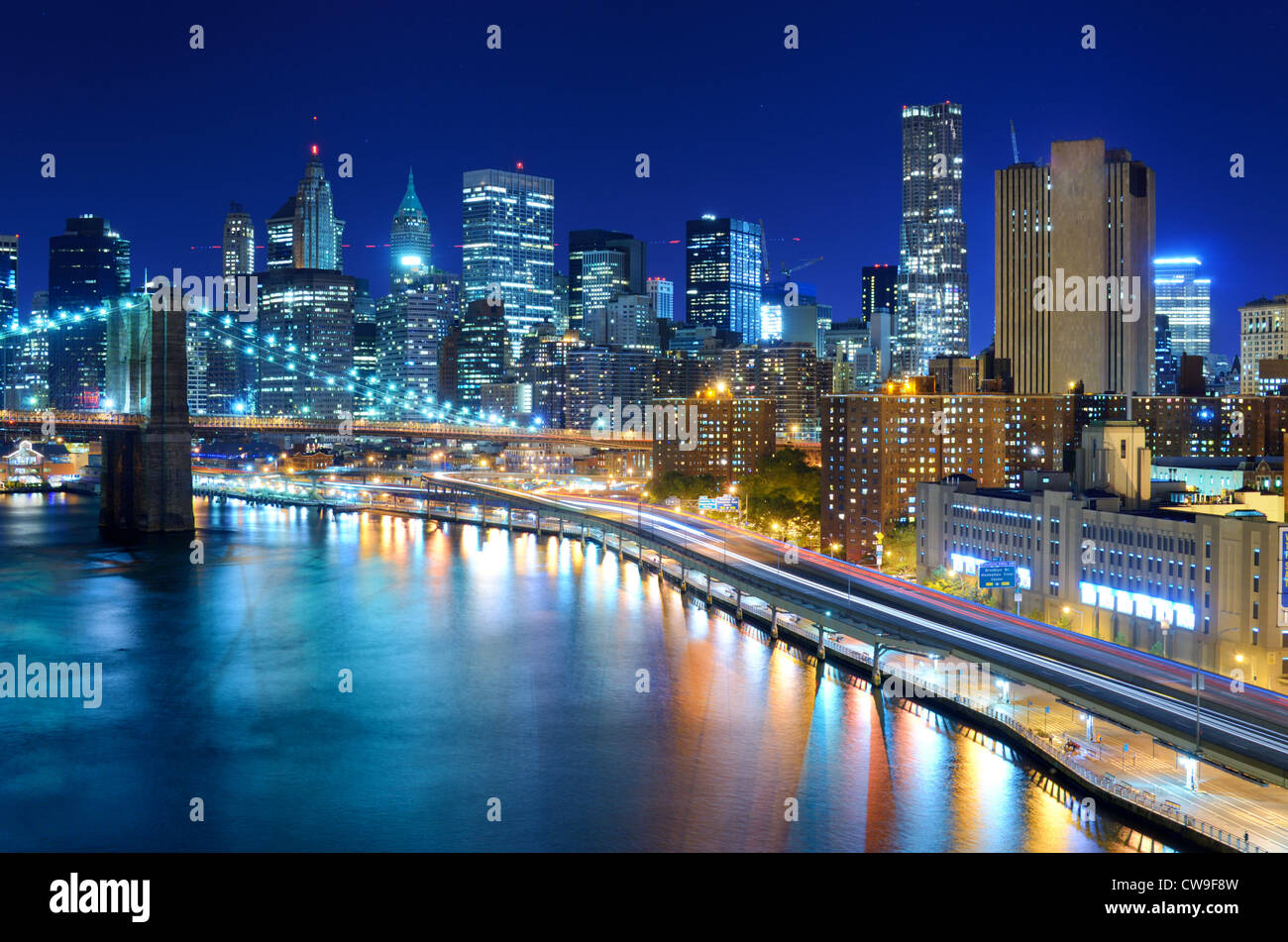 View of the financial district of Manhattan at night in New York City ...