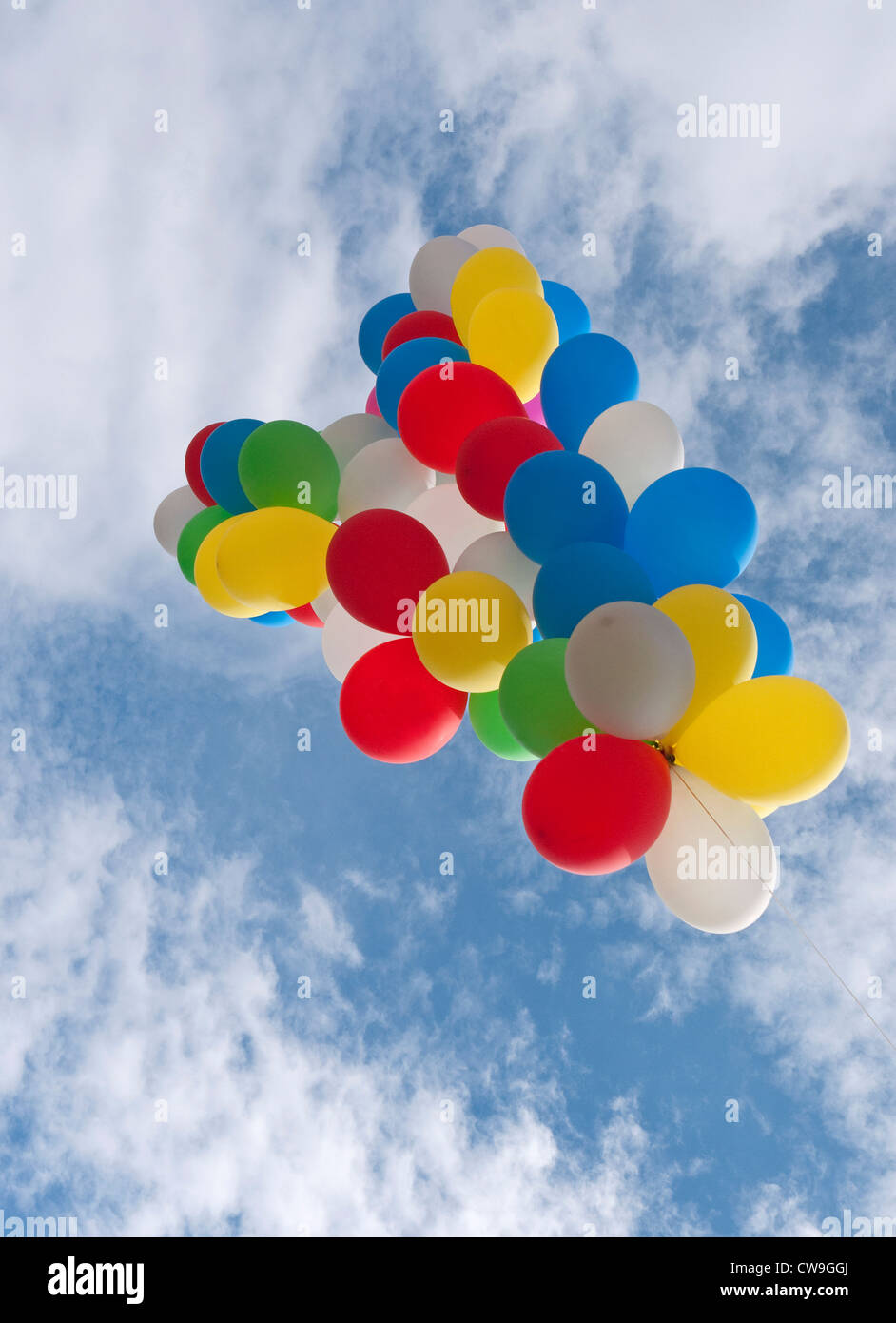 colourful balloons flying on blue sky background Stock Photo - Alamy