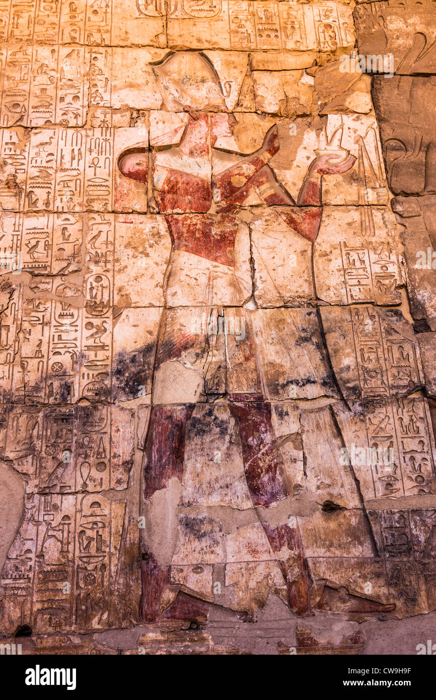 Relief of Ramses II worshipping Osiris on the portico of the Temple of Seti I in Abydos, Egypt Stock Photo