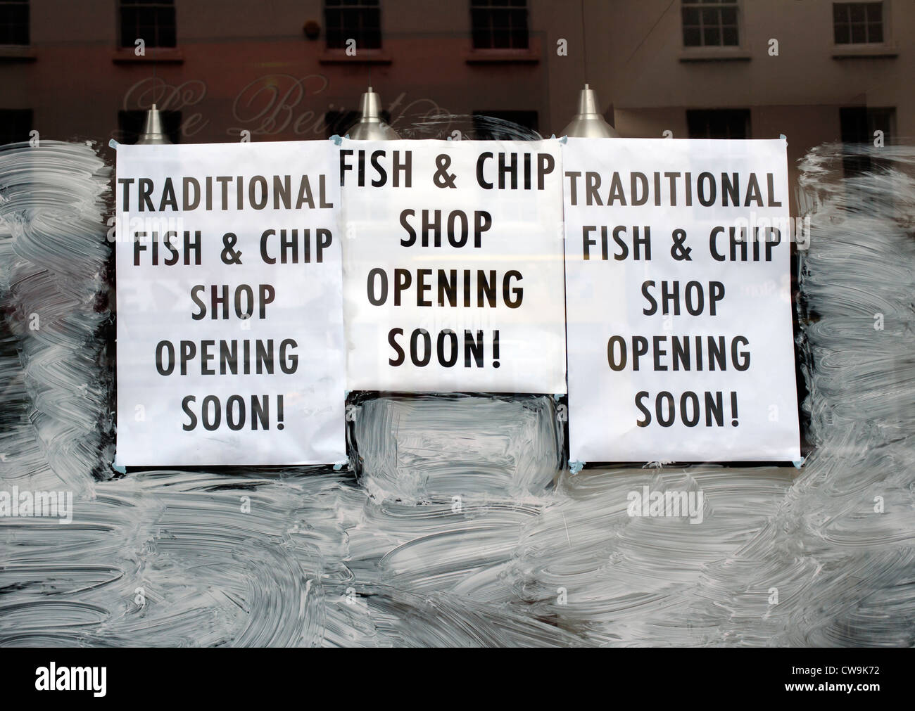 Shop window advertising new opening as fish & chip shop, Baker Street, Marylebone, London, UK, Europe Stock Photo