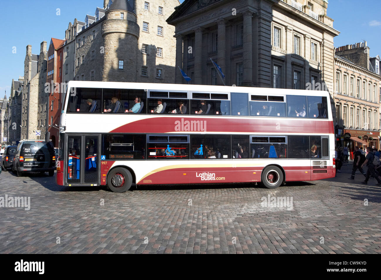 double decker lothian buses bus on the royal mile old town edinburgh scotland uk united kingdom