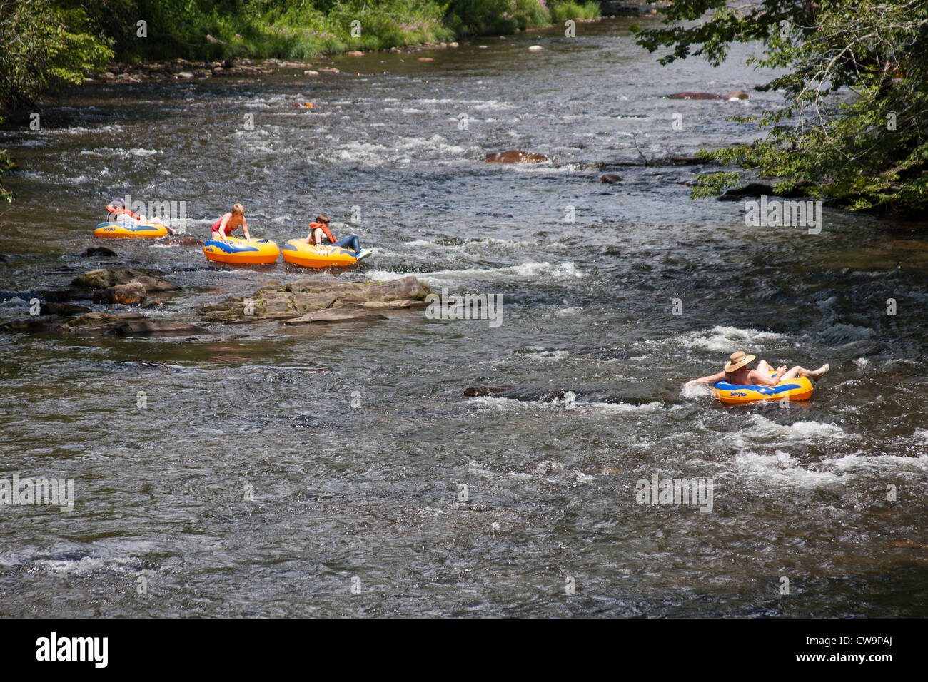 Man tubing fun sport river rafting hires stock photography and images