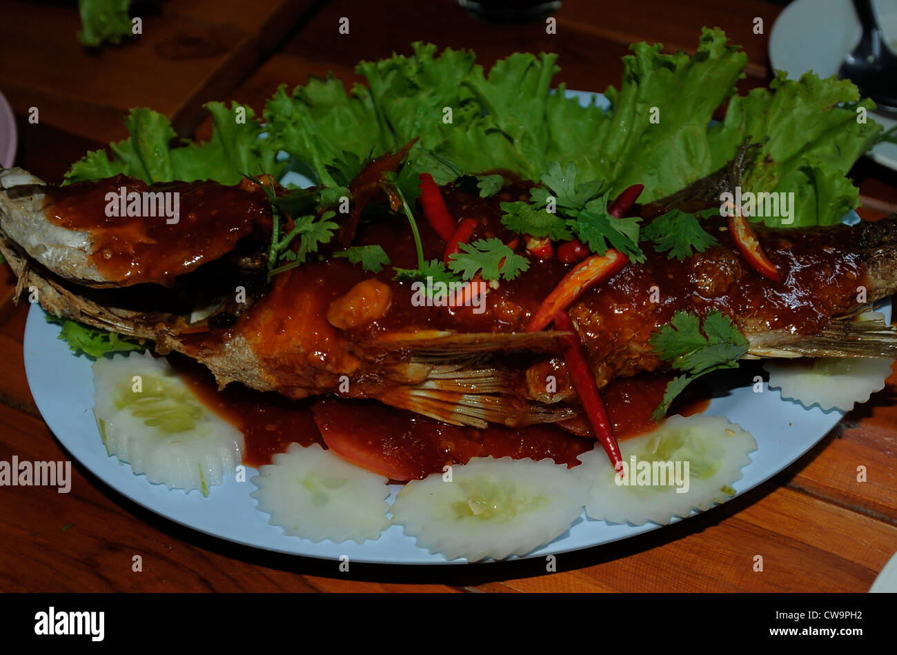 deep fried sea bass thai three style sauce (sweet , sour and spicy) side streets of bangkok