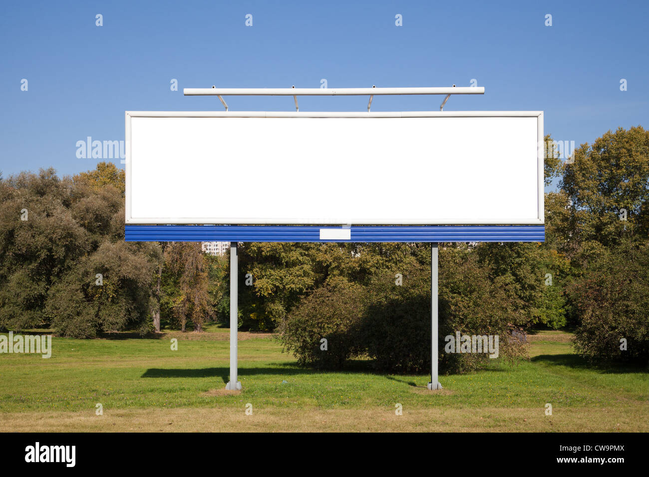 Blank billboard on green grass for your advertisment Stock Photo - Alamy