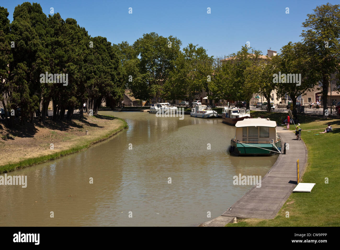 Canal boats moored on the Canal du Midi as it passes through Carcassonne in the South of France Stock Photo