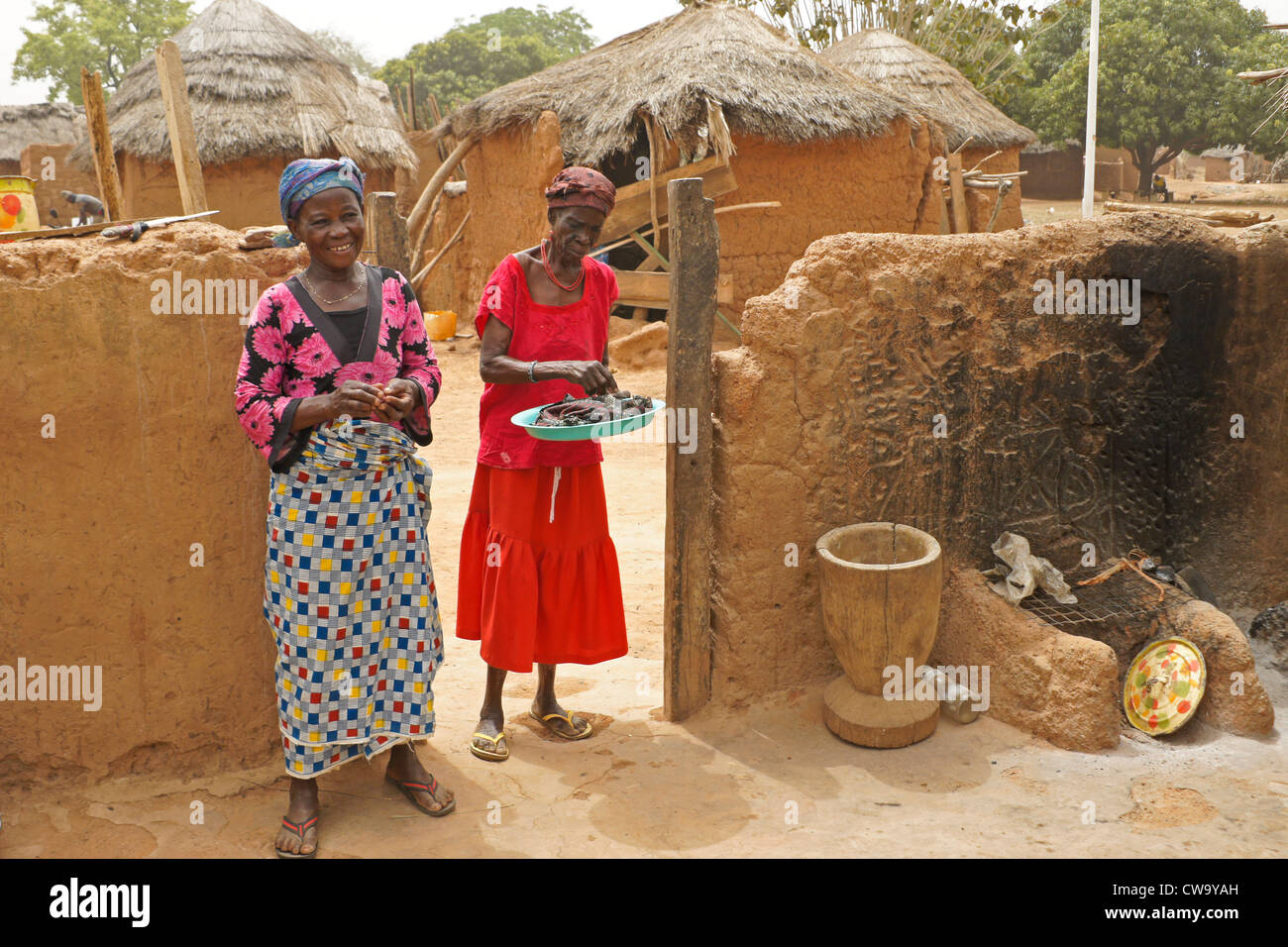 Women in house compound, Mognori Eco-Village, Ghana Stock Photo