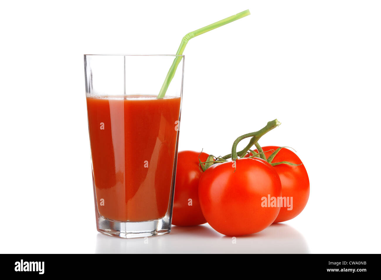 Tomato juices in glass with a straw and tomatoes Stock Photo Alamy