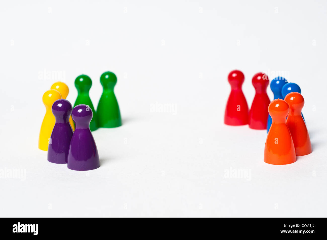 Colourful pawns in semi-circle Stock Photo