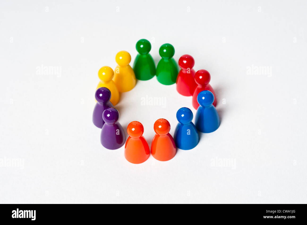 Colourful pawns making a circle Stock Photo