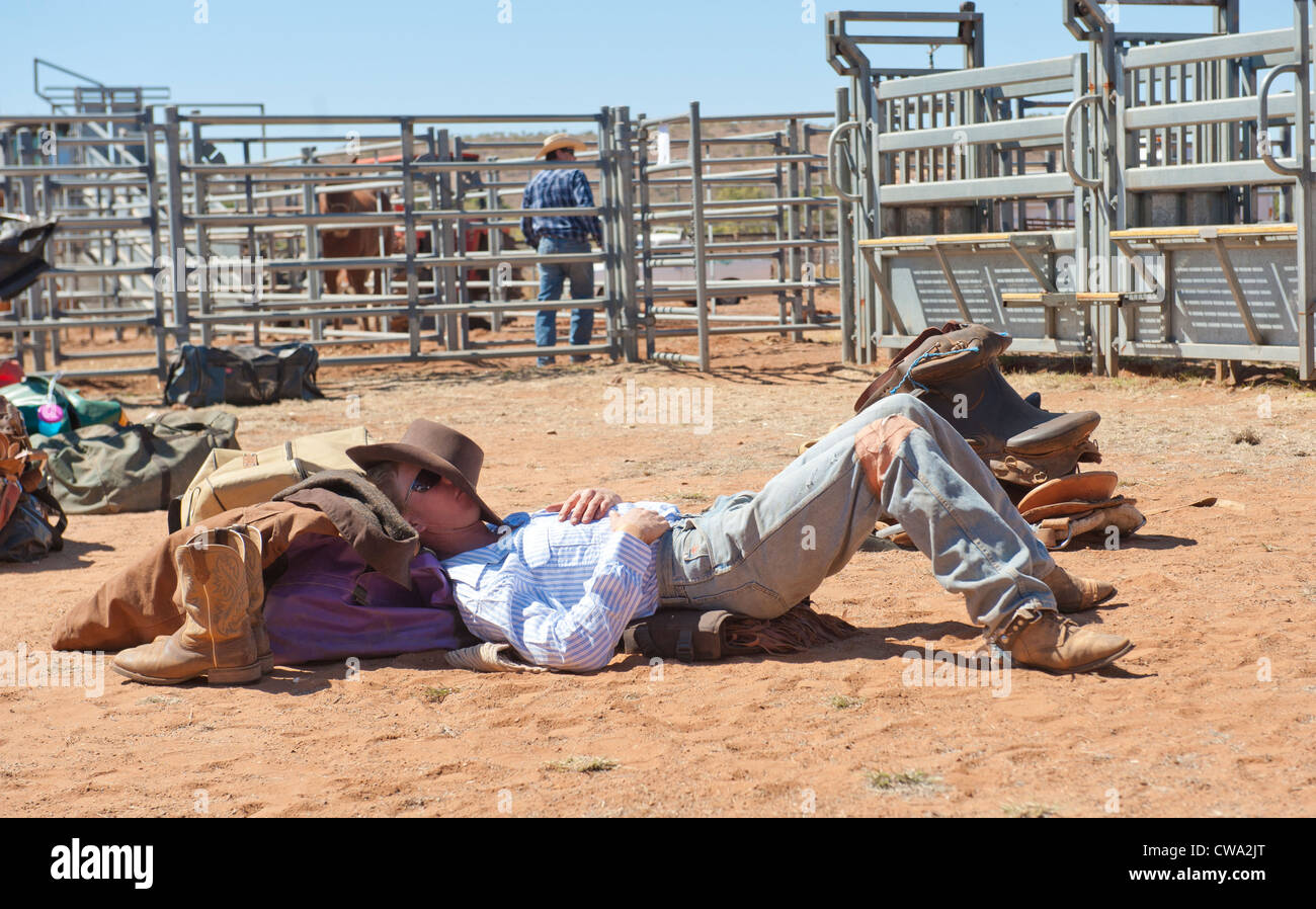 Cowboy taking a nap at the stockyard of Mount Isa Rodeo Stock Photo