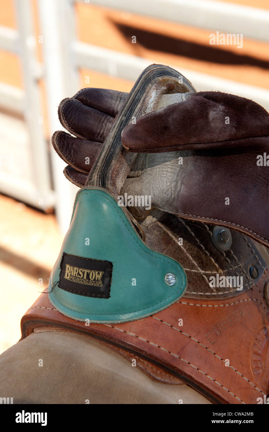 Detail of saddleback bronc riding at the Mount Isa Rodeo 2012 with close-up of saddle and leather glove Stock Photo