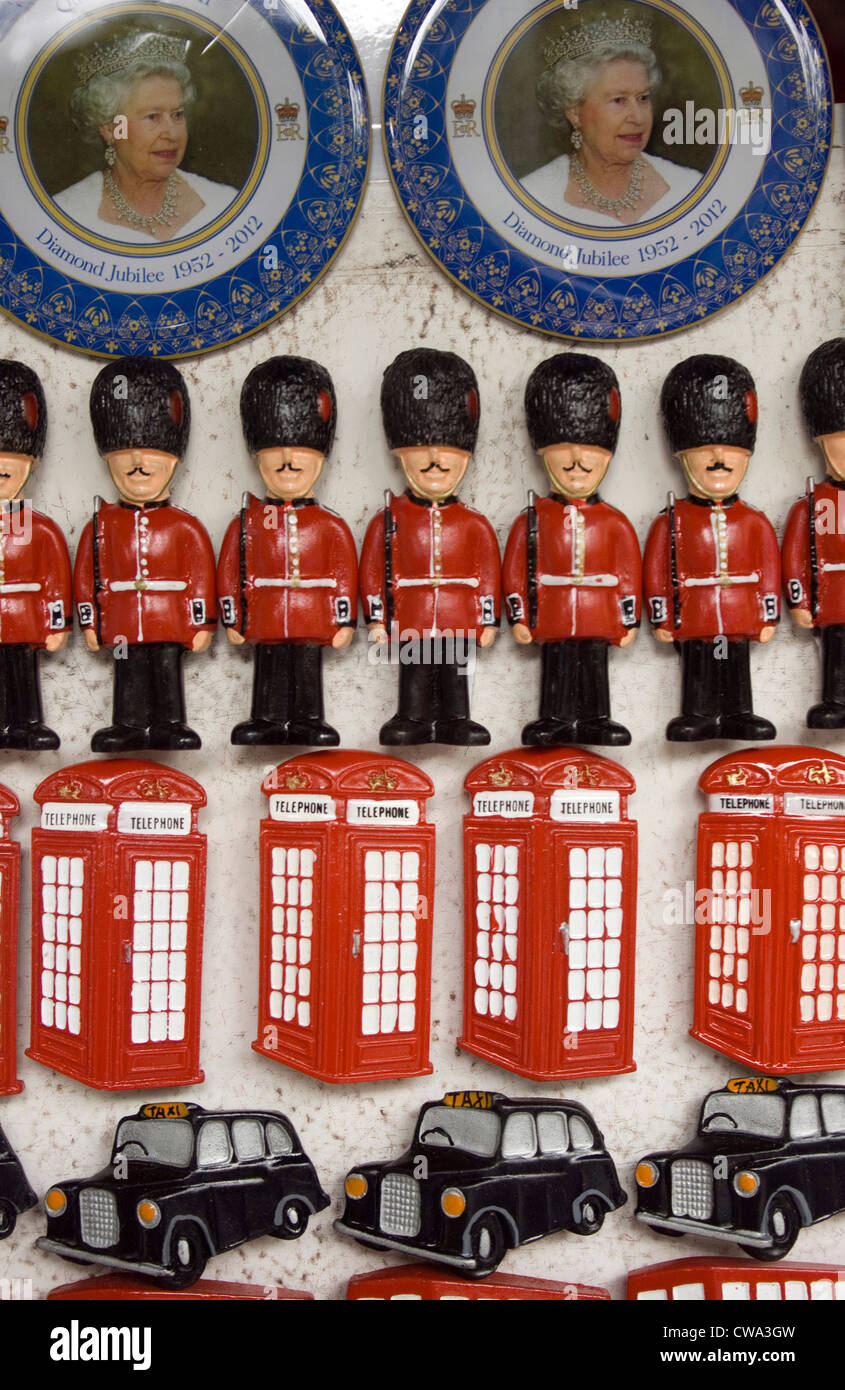 London tourist fridge magnets showing plates to commemorate the Queens Diamond Jubilee telephone boxes, taxis, buses and guards Stock Photo