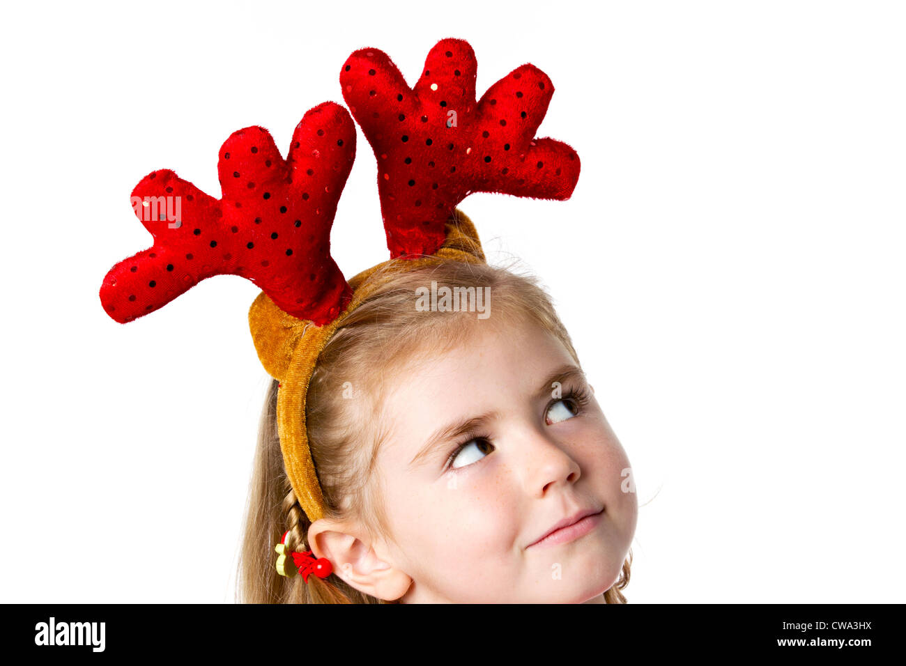 little girl wearing Christmas hat Stock Photo Alamy