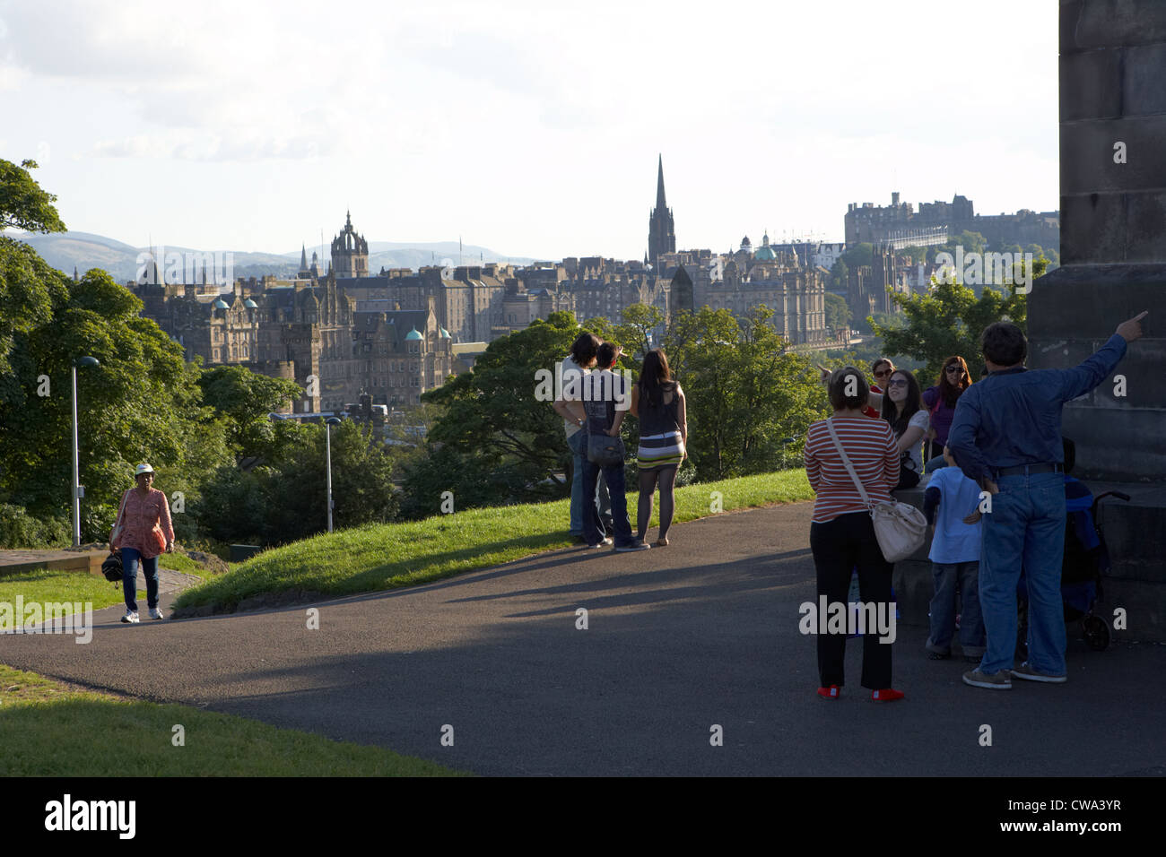 tourists on calton hill looking down at edinburgh scotland uk united kingdom Stock Photo