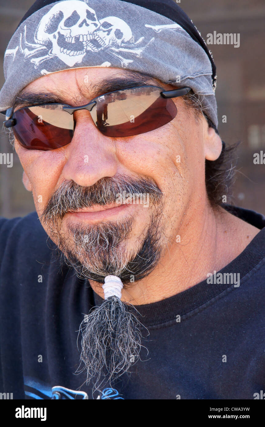 man male with beard glasses bandana head scarf headshot shot portrait hispanic  latino riding street Stock Photo - Alamy