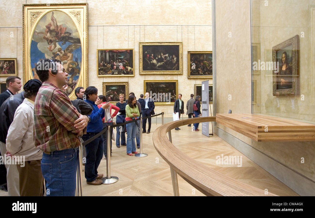 Paris, museum visitors viewing the Mona Lisa at the Louvre Stock Photo