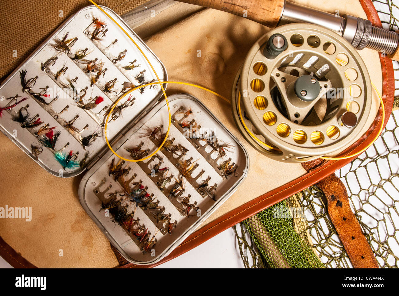 Still life of fly fishing rod, reel, fly box next and fishing bag and  equipment Stock Photo - Alamy