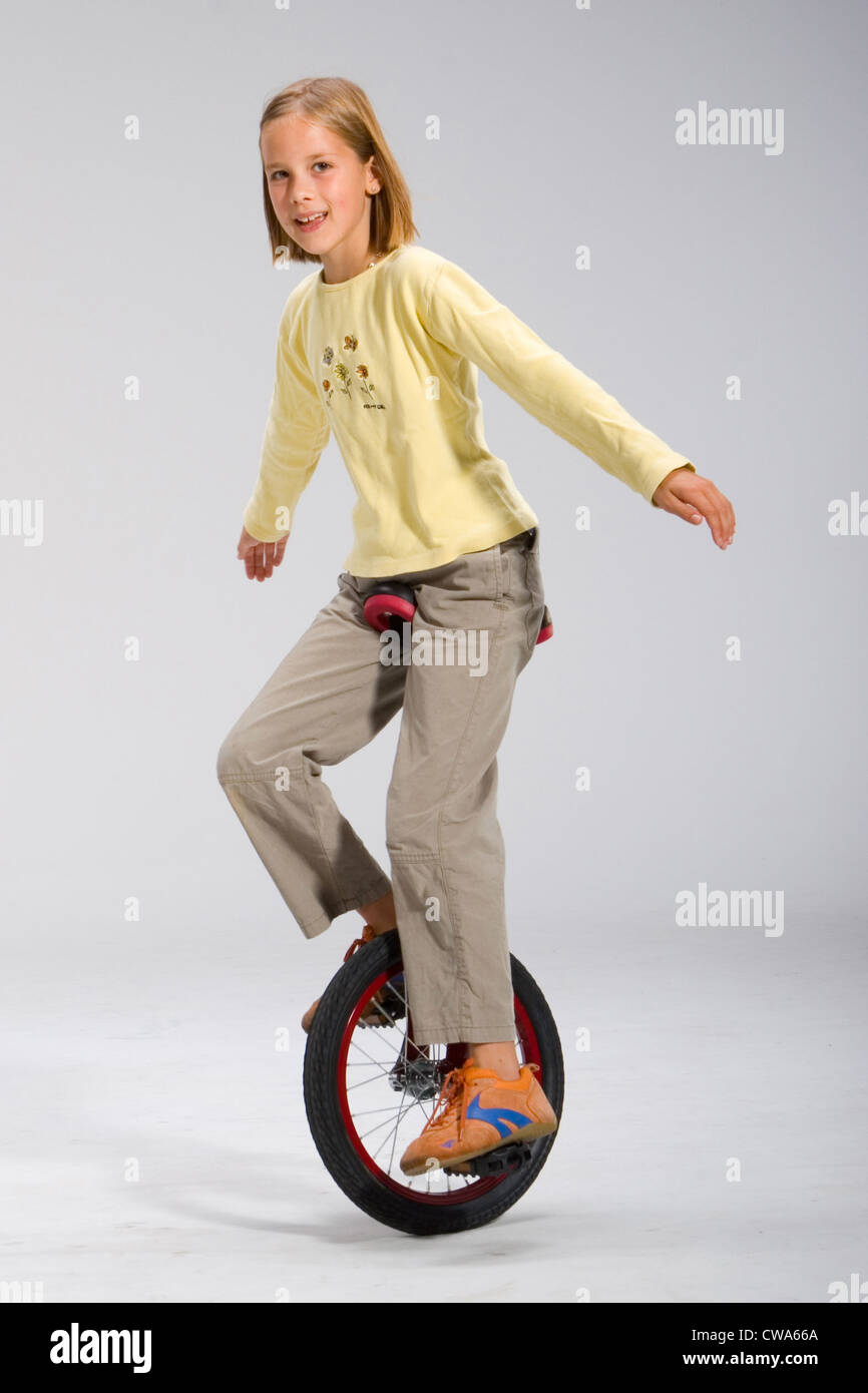 Berlin, girl on a unicycle Stock Photo Alamy