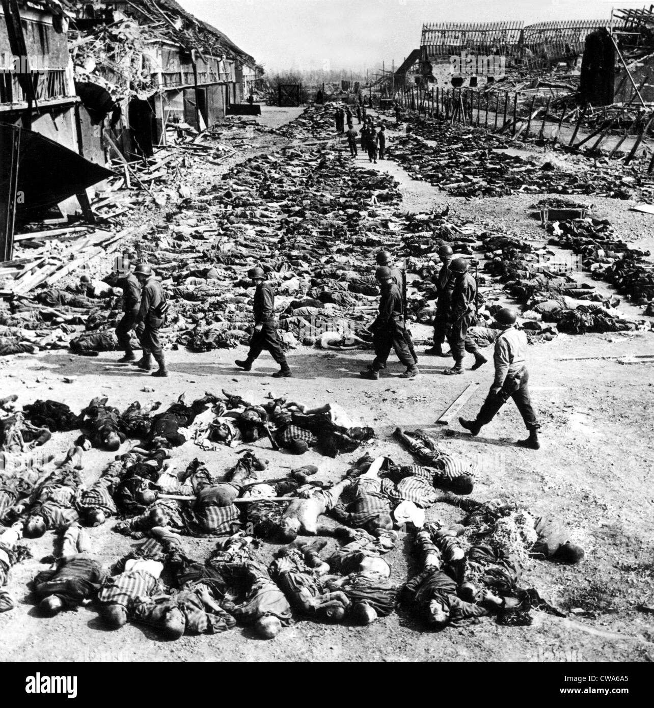 NORDHAUSEN, GERMNAY--Row upon row of starved emaciated bodies fill the yard of Lager Nordhausen, much-bombed German Stock Photo