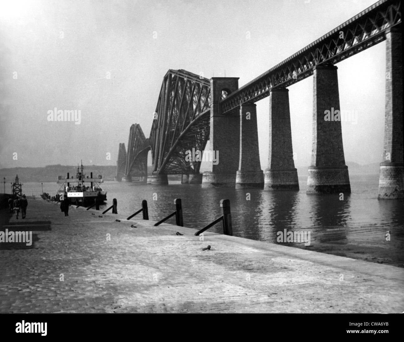 FORTH BRIDGE-Firth of Forth Bridge and ferry Boat, Edinburgh, Scotland. 5/18/37. Courtesy: CSU Archives / Everett Collection Stock Photo