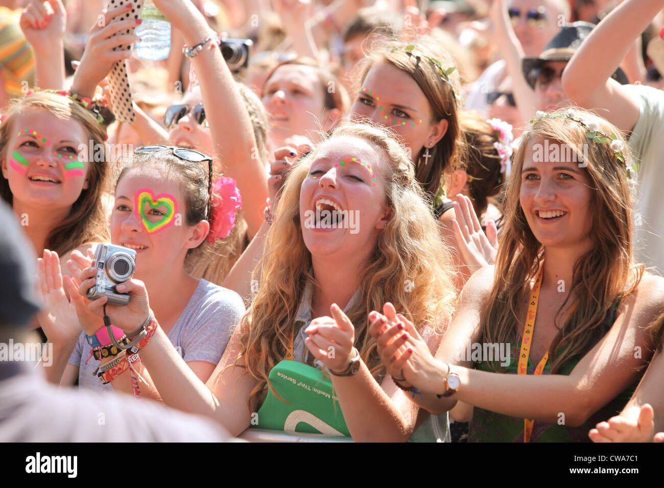 The crowd enjoying the live music at the V Festival in Hylands Park, Chelmsford, Essex Stock Photo