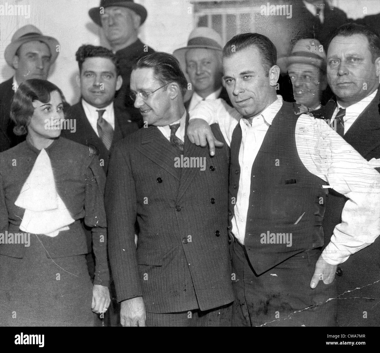 JOHN DILLINGER-Dillinger with Prosecuting Attorney, Robert Estill and Sheriff Lillian Holley, his jailer, at the jail in Crown Stock Photo
