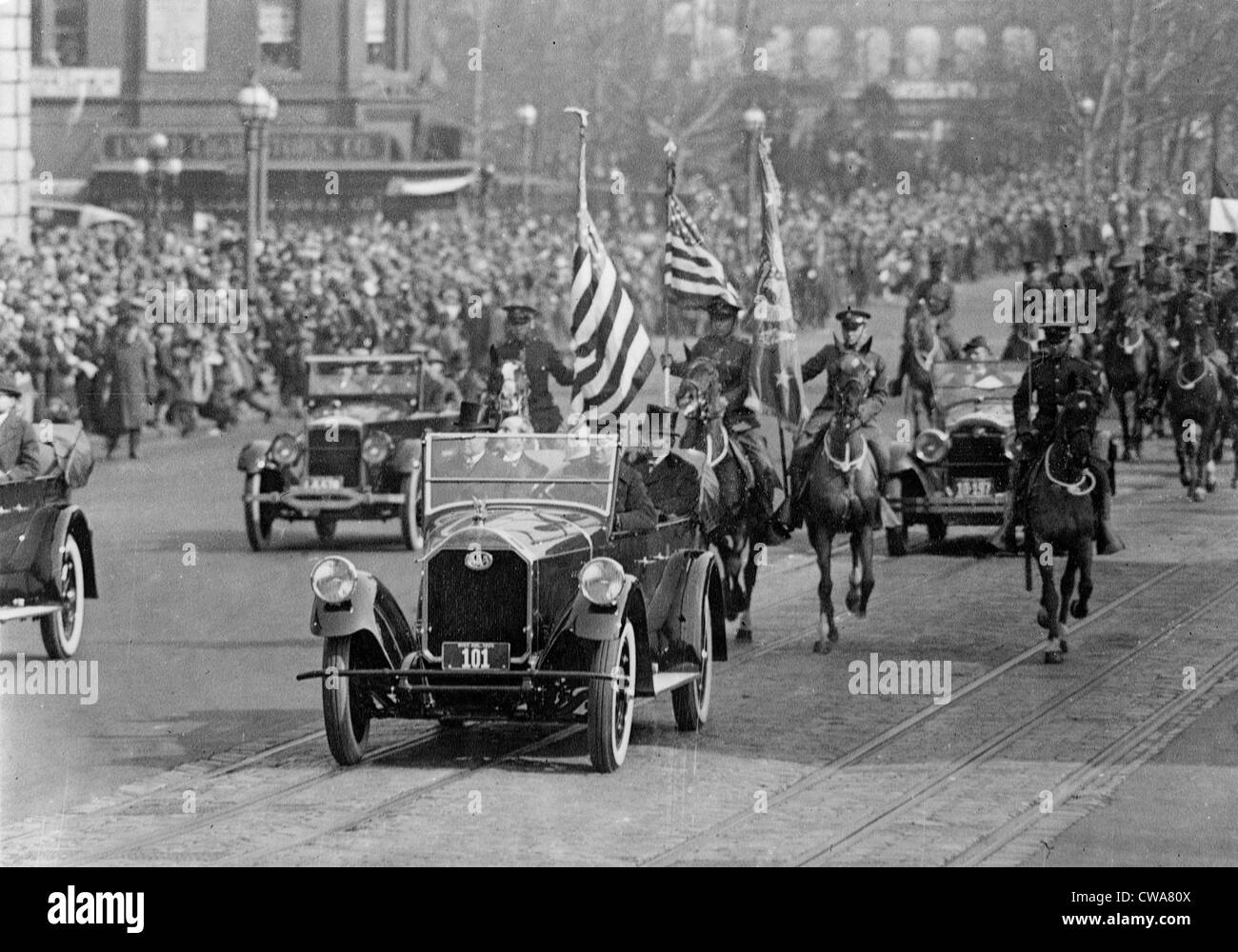 President Calvin Coolidge (1872-33) and others riding in a car during his inaugural parade. March 4, 1925. Stock Photo