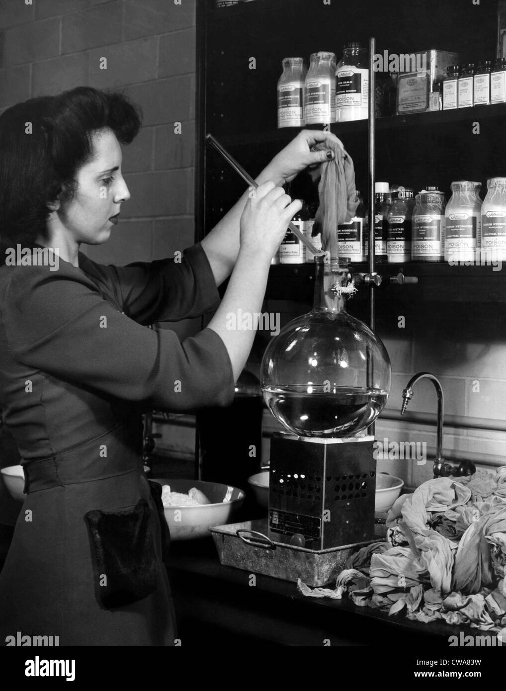 A woman recycles stockings into new nylon for vital military uses at the Du Pont Research Laboratory, 1940s. Courtesy: CSU Stock Photo