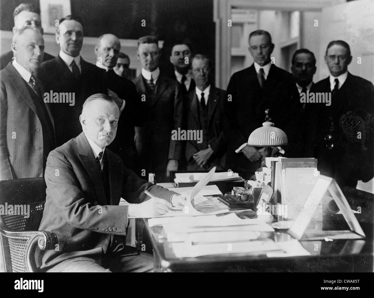 President Calvin Coolidge (1872-33) signing the Cameron Bill which authorizes the construction of the Coolidge Dam in Arizona. Stock Photo