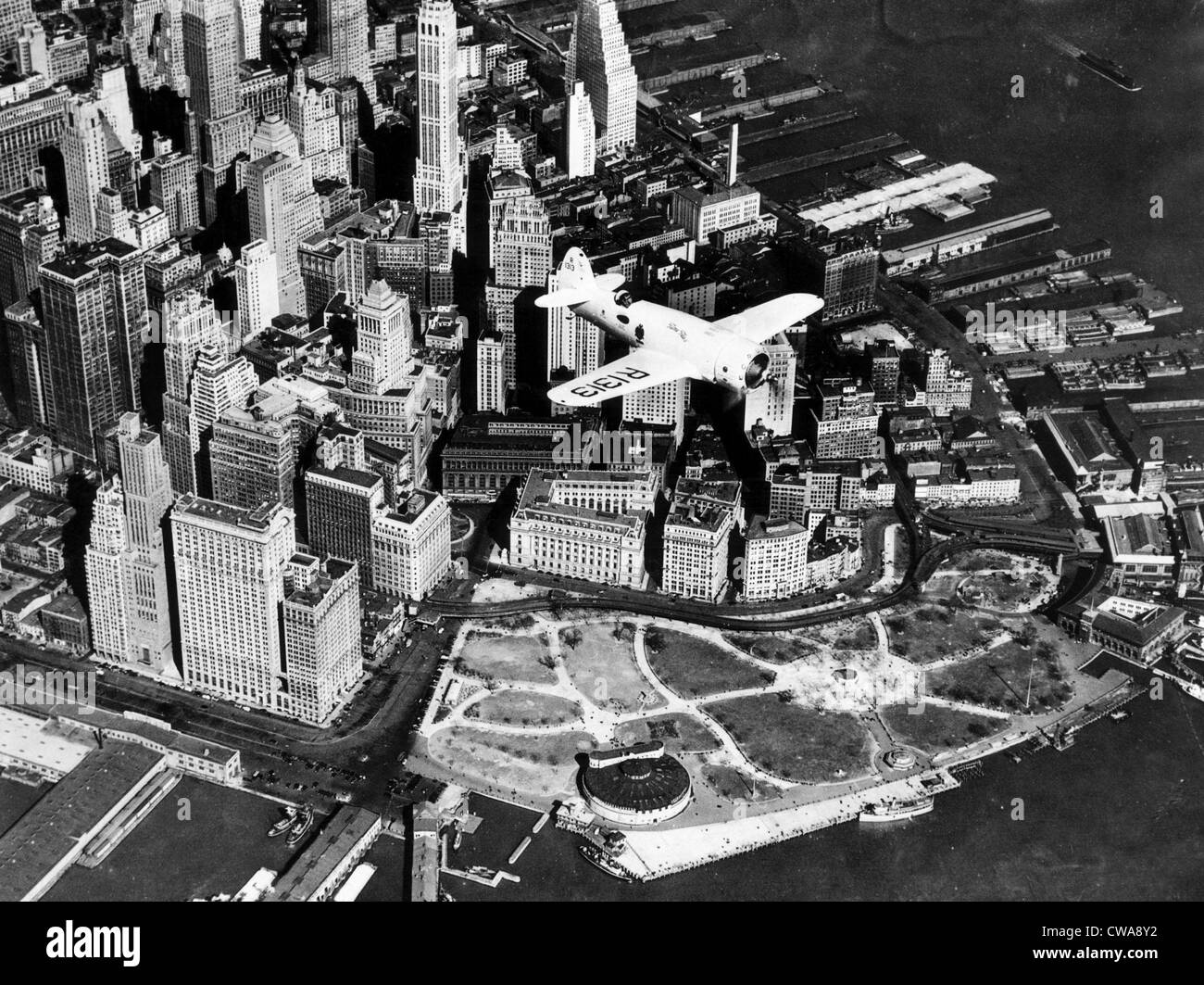 Captain Frank Hawks' new Speed Plane flying over Manhattan's financial district and Battery Park, New York City,  April 3, Stock Photo