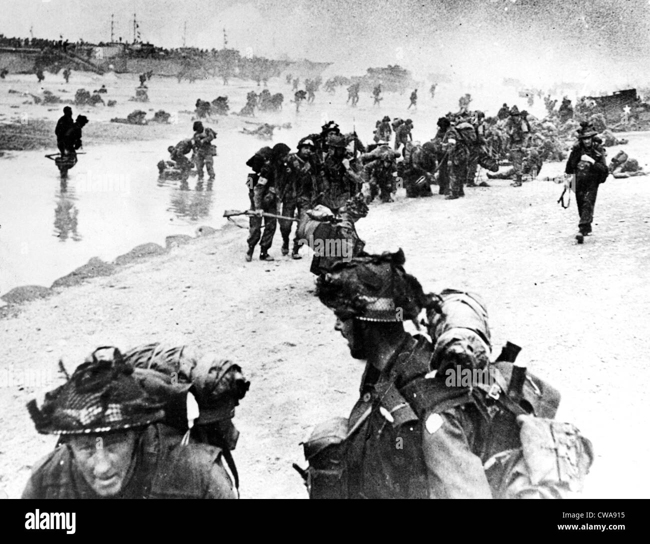 NORMANDY, British troops marching off to the attack after landing in their assault boats, 6/14/44. Courtesy: CSU Archives / Stock Photo